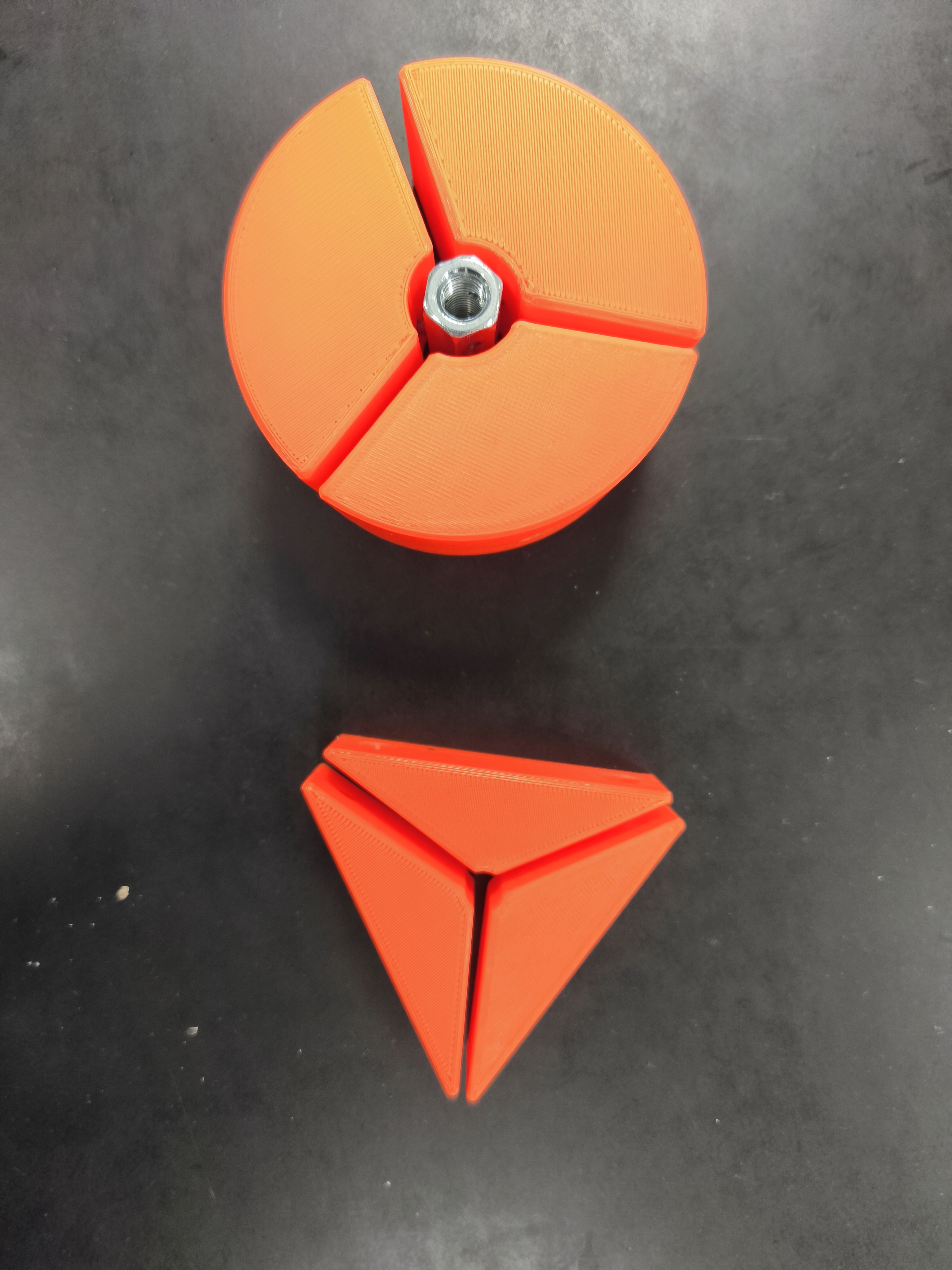 Physical HexaClamp prototype photographed upright